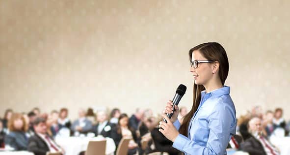 graphicstock beautiful business woman is speaking on conference rRgbIO1i Z 1024x546 1